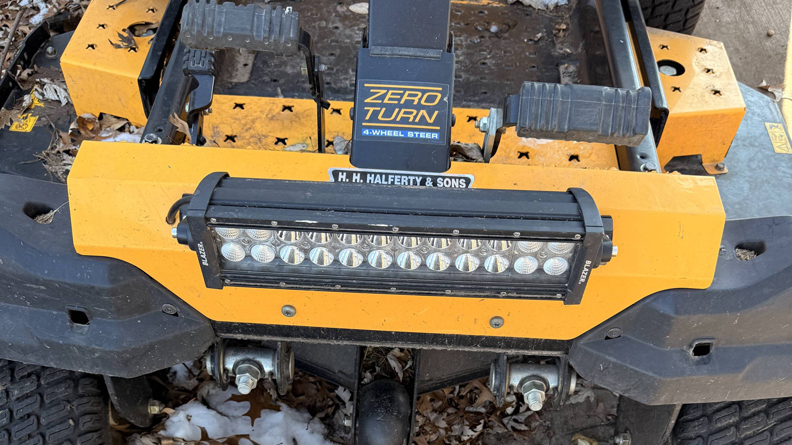 Zero-turn mower with a custom LED light bar, serviced by Crafted Steel Mechanics in the Kansas City Northland